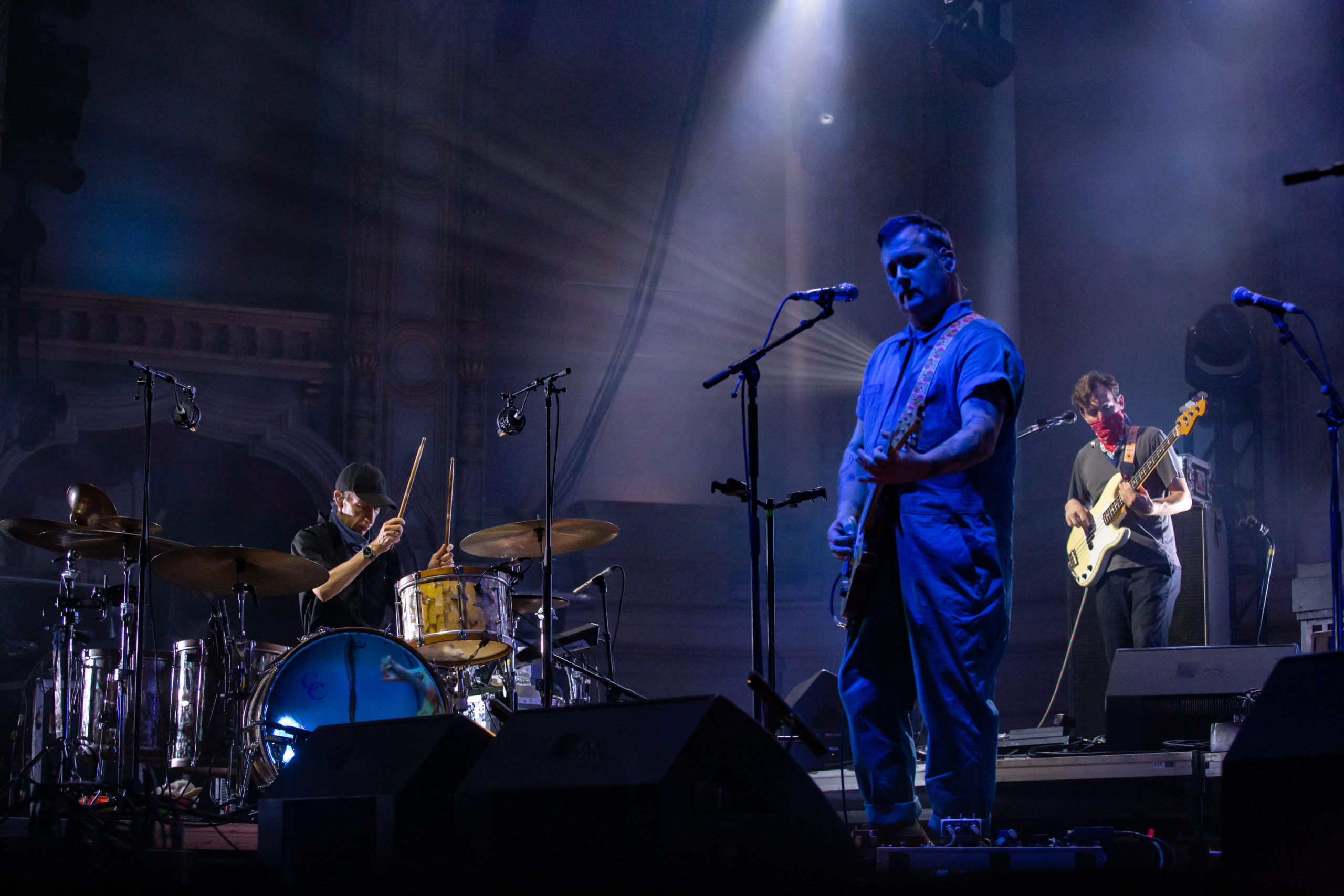 Three band members of Modest Mouse on stage at the Orpheum Theatre