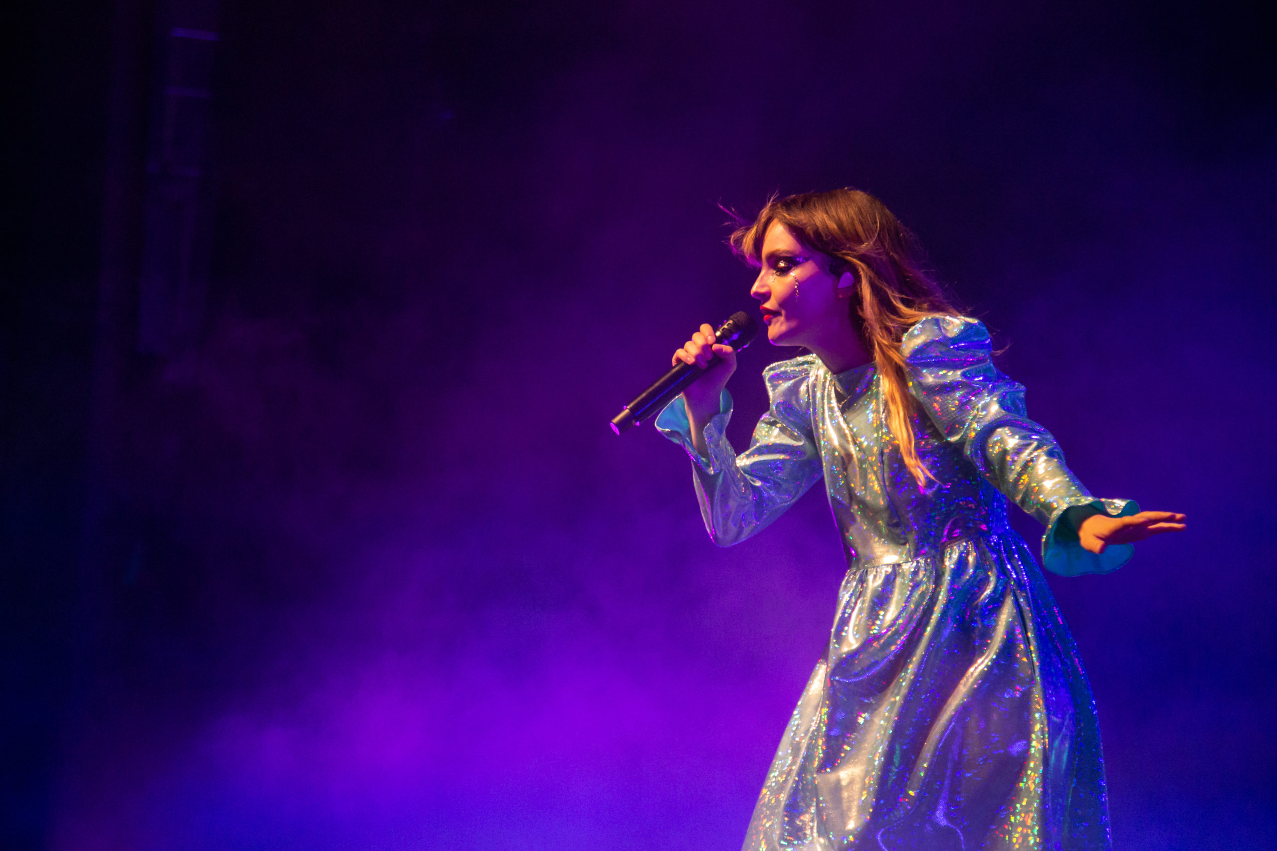 In an iridescent dress, Lauren Mayberry dazzles the crowd at the Queen Elizabeth Theatre