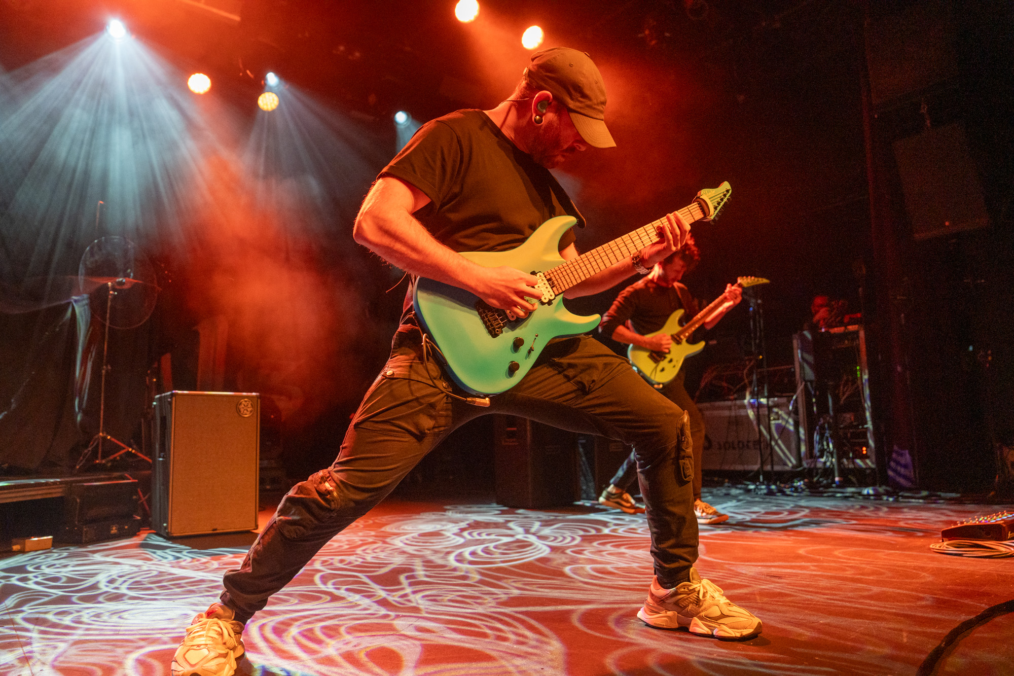 Aaron Marshal of intervals playing guitar